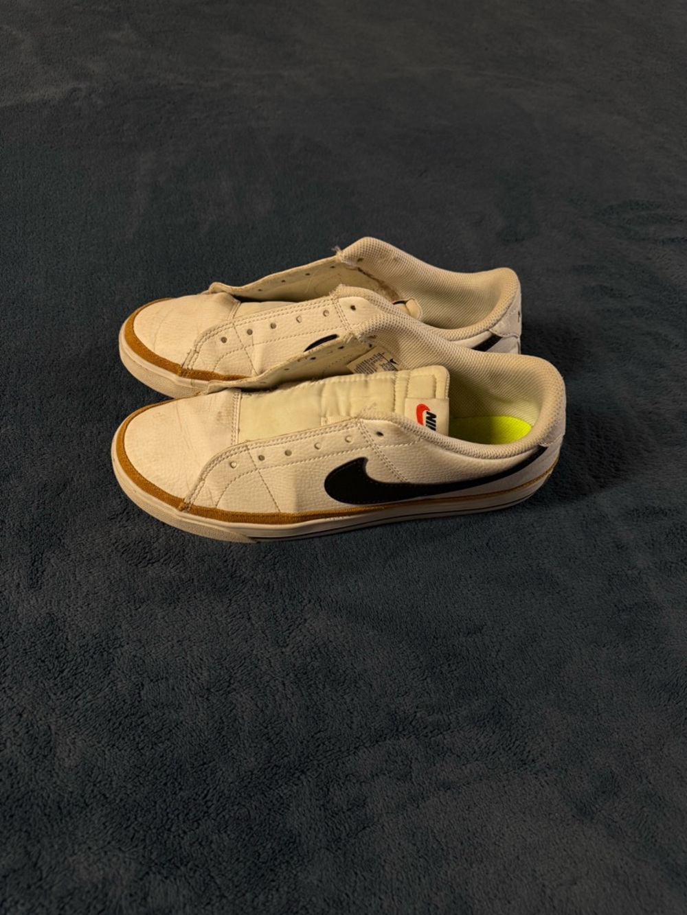 Nike White Low-Top Sneakers with Black Swoosh and Tan Trim